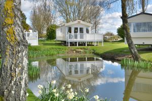 View across lake to property- click for photo gallery